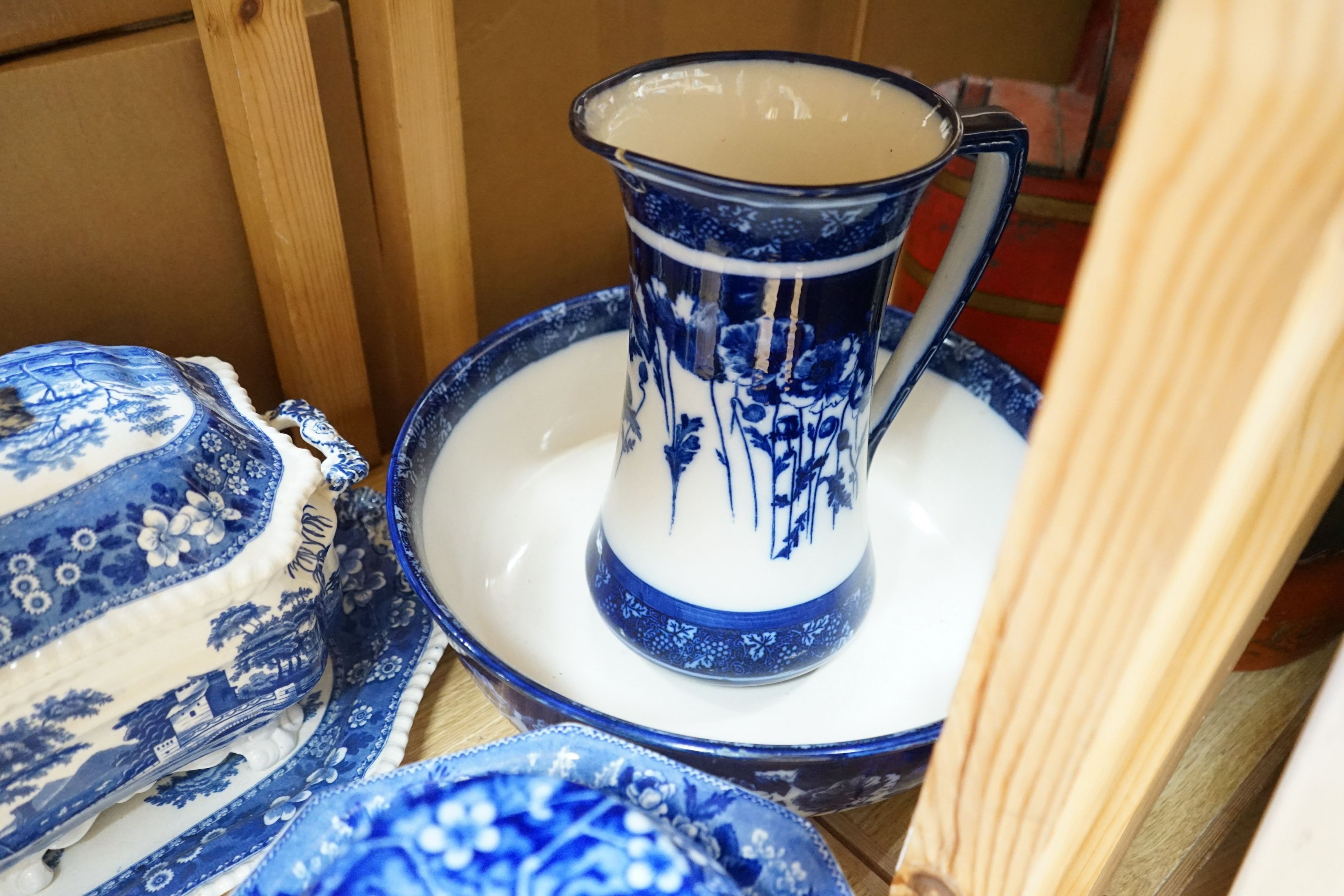 A blue and white jug and basin, tureen, cover and stand, slop pail, a jar and cover and three bowls